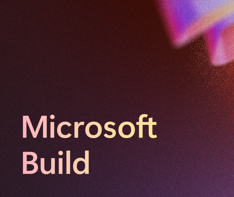 Une image avec Microsoft Build dans le coin inférieur gauche, un fond rouge foncé qui devient pixelisé et plus clair vers le côté droit, et des images de tubes triangulaires sur le côté droit.